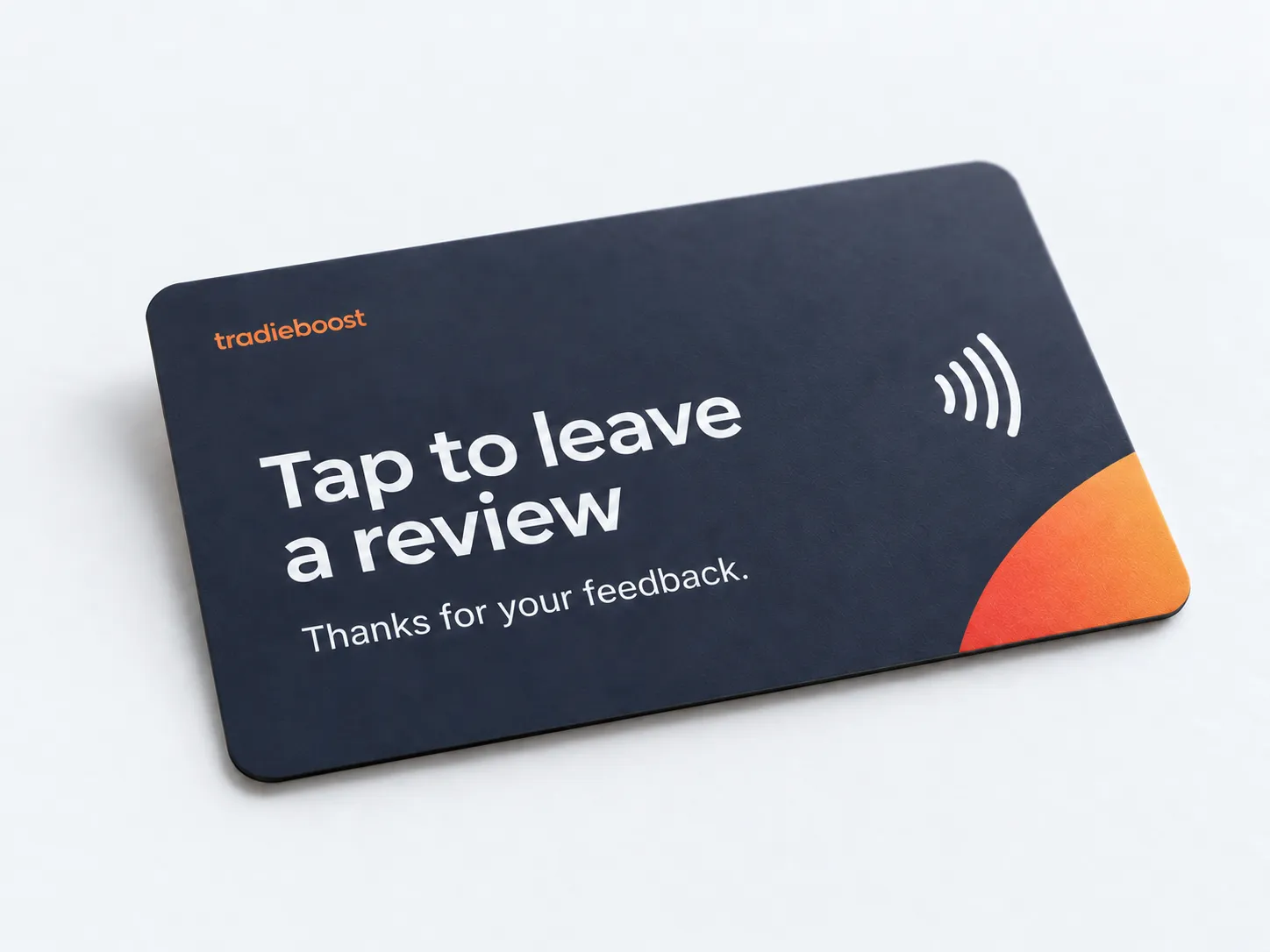 Navy tap-to-review card with a small Tradieboost logo and contactless symbol.